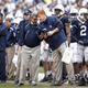 Joe Paterno and assistant Mike McQueary (Getty Images)